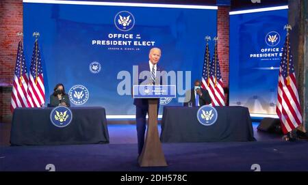 United States President-elect Joe Biden delivers remarks introducing retired US Army four-star General Lloyd J. Austin III, as his nominee to serve as the 28th US Secretary of Defense from the Queen Theatre in Wilmington, Delaware on Wednesday, December 9, 2020. US Vice President-elect Kamala Harris looks on from left and Gen. Austin looks on from right.Credit: Biden Transition via CNP /MediaPunch Stock Photo