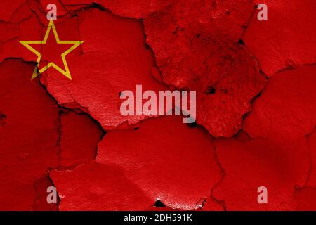 Historical flag of Socialist Republic of Macedonia on cracked wall Stock Photo