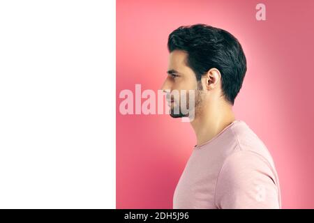 Close up profile view portrait of handsome man on geometric background Stock Photo