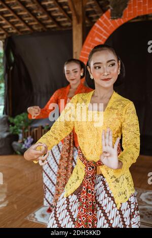 portrait expression young women performing traditional Javanese dancing Stock Photo