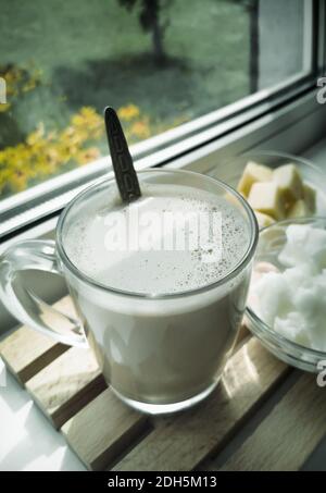 Bulletproof coffee: coffee whipped with cream and coconut oil. Stock Photo