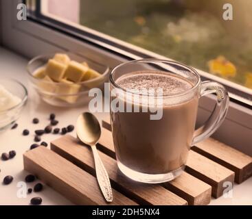 Bulletproof coffee: coffee whipped with cream and coconut oil. Stock Photo