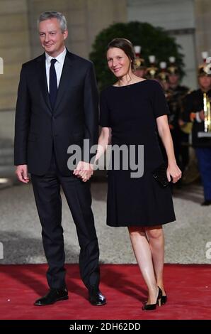 Bruno Le Maire and wife Pauline Doussau de Bazignan arriving for a state dinner honoring Lebanese President Aoun at the Elysee palace in Paris, France, September 25, 2017. Photo by Christian Liewig/ABACAPRESS.COM Stock Photo