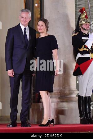 Bruno Le Maire and wife Pauline Doussau de Bazignan arriving for a state dinner honoring Lebanese President Aoun at the Elysee palace in Paris, France, September 25, 2017. Photo by Christian Liewig/ABACAPRESS.COM Stock Photo