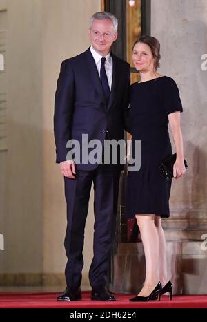 Bruno Le Maire and wife Pauline Doussau de Bazignan arriving for a state dinner honoring Lebanese President Aoun at the Elysee palace in Paris, France, September 25, 2017. Photo by Christian Liewig/ABACAPRESS.COM Stock Photo