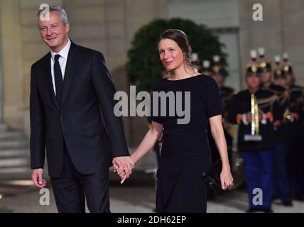 Bruno Le Maire and wife Pauline Doussau de Bazignan arriving for a state dinner honoring Lebanese President Aoun at the Elysee palace in Paris, France, September 25, 2017. Photo by Christian Liewig/ABACAPRESS.COM Stock Photo