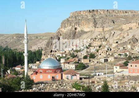 the mosque and the village of Yaprakhisar near the Ihlara valley in Cappadocia - Turkey Stock Photo