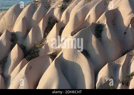 typical rock formations at the twilight in Cappadocia, Turkey Stock Photo