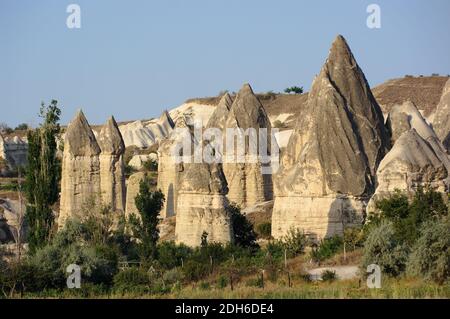 group of fairy chimneys typical rock formation in Goreme, Cappadocia - Turkey Stock Photo