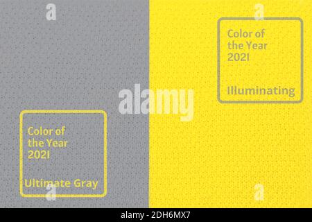 Bright illuminating yellow and gray colours knitted sweater. Trendy colors of the year 2021 - Gray and Yellow. Fashionable clothes colors. Stock Photo
