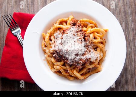 pici pasta with lamb ragu and parmesan cheese Stock Photo