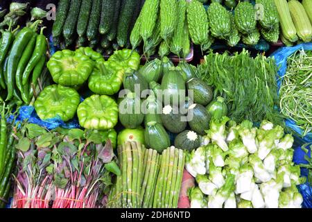 heap of fresh vegetables on the stall for sale in the market