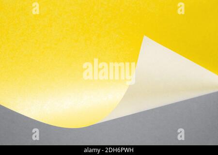 Illuminating yellow and Ultimate Gray curve paper abstract background for color of the year 2021 Stock Photo