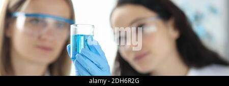 Two scientists are conducting experiments in laboratory Stock Photo