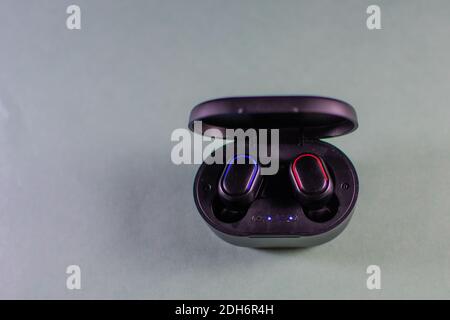 wireless earphones and a cell phone Stock Photo
