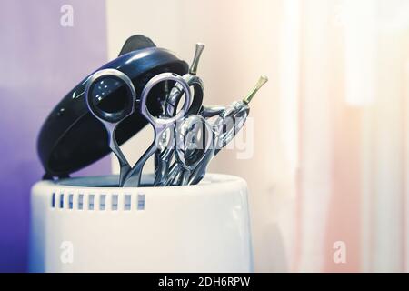 Close-up of scissors in a stand. Beauty salon tools. Selective soft focus Stock Photo