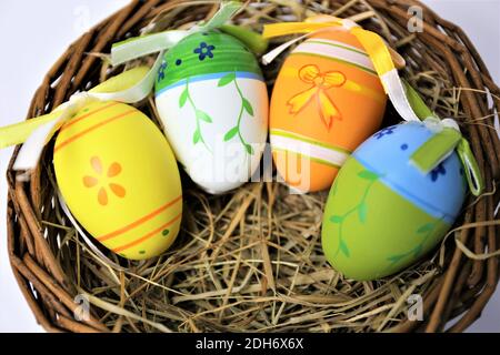 easter eggs in basket on white background Stock Photo