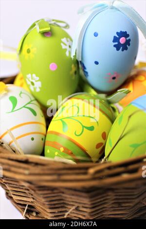 easter eggs in basket on white background Stock Photo