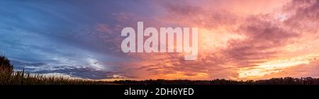 Colorful and dramatic sky panorama of sunset background Stock Photo