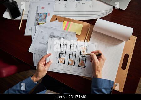 Office worker checking important documents at the desk Stock Photo