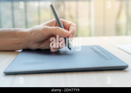 Video artist using graphics tablet. Stock Photo