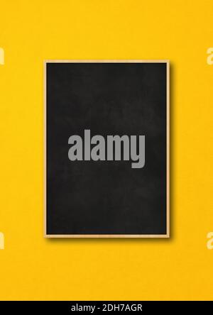 Traditional black board isolated on a yellow background Stock Photo