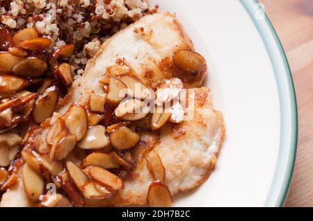 roasted almonds in a lemon sauce over pan fried sole and quinoa Stock Photo