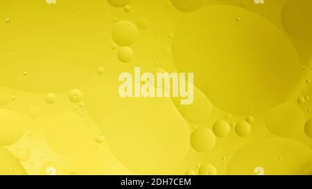 oil with bubbles on yellow,background. Orange Abstract space background. Soft selective focus. macro of oil drops on water surface. copy space. air bu Stock Photo