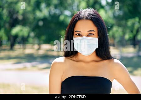 Close up portrait of african american woman in virus protection face mask Stock Photo