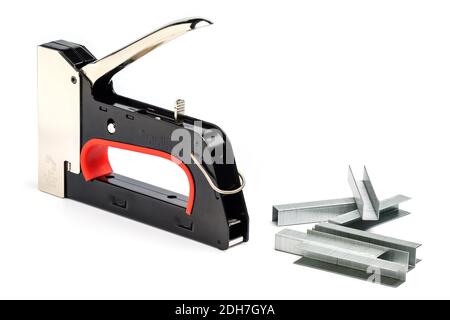 Staple Gun With Staples Isolated On White Background. Heavy-Duty Steel Staple Gun To Repairs Around Your Home. Stock Photo