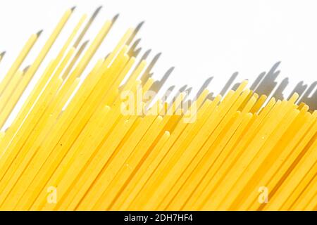 Uncooked whole grain spaghetti closeup, italian pasta as organic food ingredient, macro product and cook book recipe Stock Photo