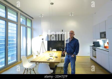 Man living in modern apartment near the new development at Osthafenplatz in Frankfurt am Main, Hesse , Germany Stock Photo