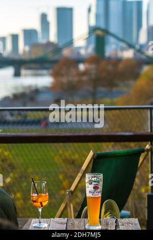 Beer and cocktail on table in rooftop bar with Frankfurt skyline in background .Frankfurt am Main, Hesse , Germany Stock Photo