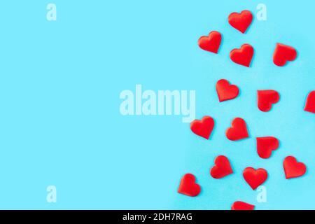 Red hearts on blue background. Stock Photo