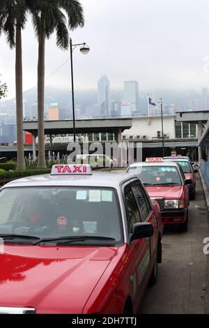 A line of red taxis in Hong Kong Stock Photo