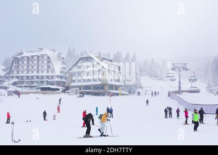 Panorama of ski resort Kopaonik, Serbia, skiers, pine trees Stock Photo