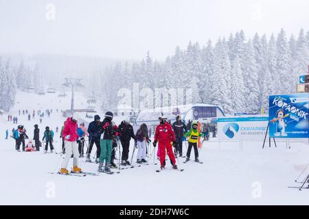 Panorama of ski resort Kopaonik, Serbia, skiers, lift, pine trees Stock Photo