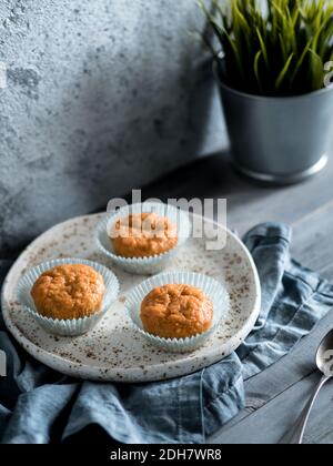 Carrot muffins on gray wooden table Stock Photo