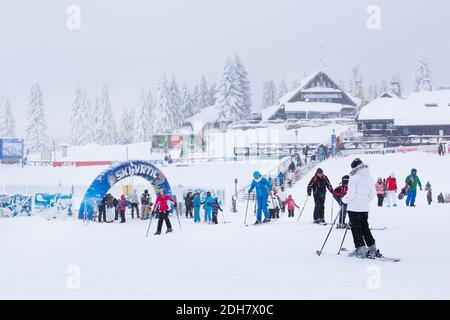 Panorama of ski resort Kopaonik, Serbia, skiers, pine trees Stock Photo
