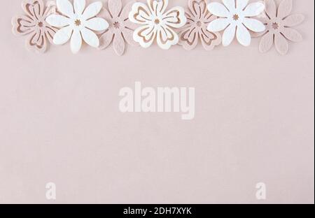 Decorative soft flowers made of felt. Creative background for Easter, Mother's day, happy birthday greeting cards. Stock Photo
