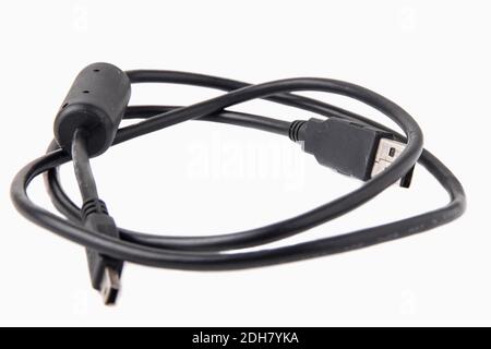 Black USB cable isolated on white background. Close-up of USB and mini-USB cable connectors Stock Photo