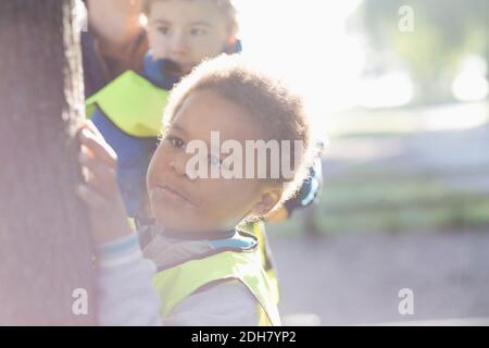 Boy exploring tree on playground Stock Photo