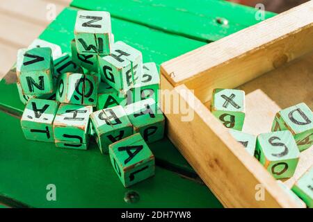 High angle view of green wooden blocks on table outside kindergarten Stock Photo