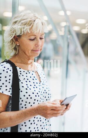 Businesswoman using digital tablet in modern office Stock Photo