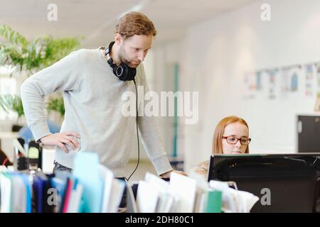 Business people using computer in creative office Stock Photo