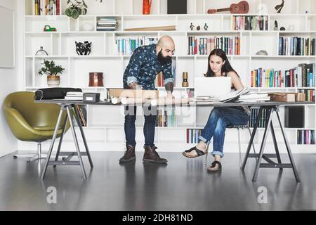 Architects working at table in home office Stock Photo