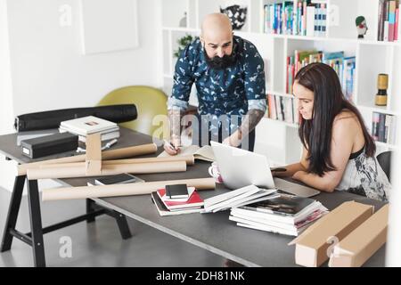 Architects using laptop at home office Stock Photo