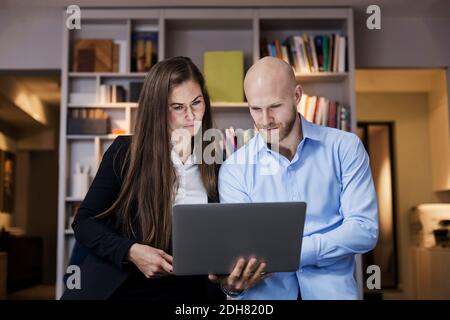 Business people using laptop in office Stock Photo