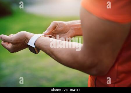 Close-up of man wearing smart watch Stock Photo