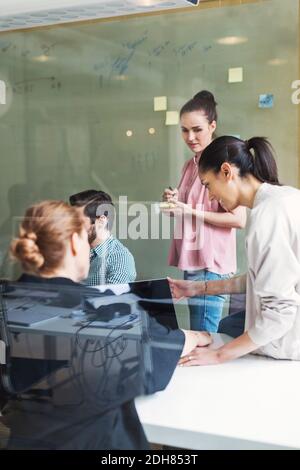 Team of business people having discussion in conference room Stock Photo